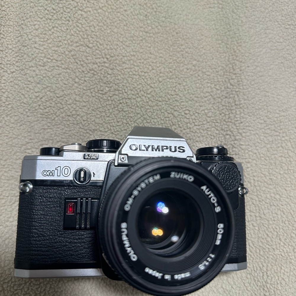 Olympus OM10 35mm Camera - Black and Silver
